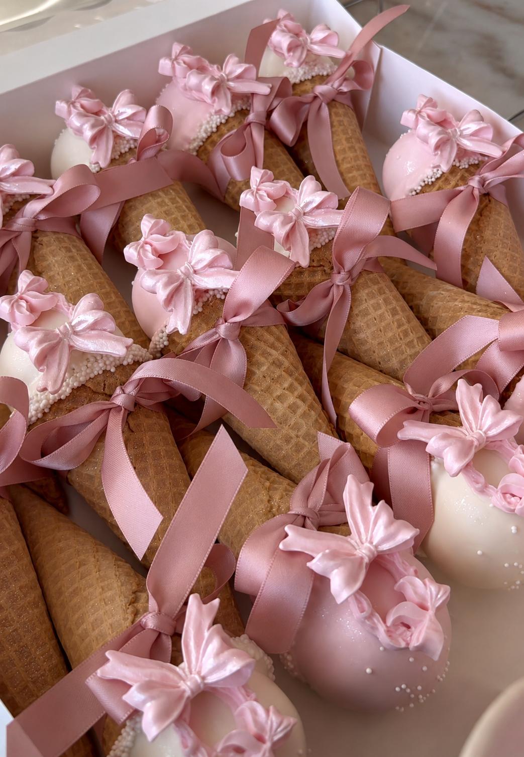 Pink cake cones with bows