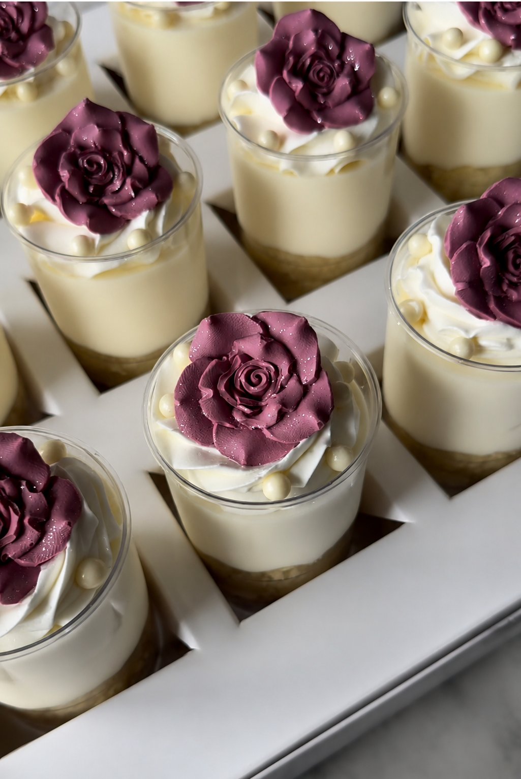 Cheesecake shooters with burgundy roses
